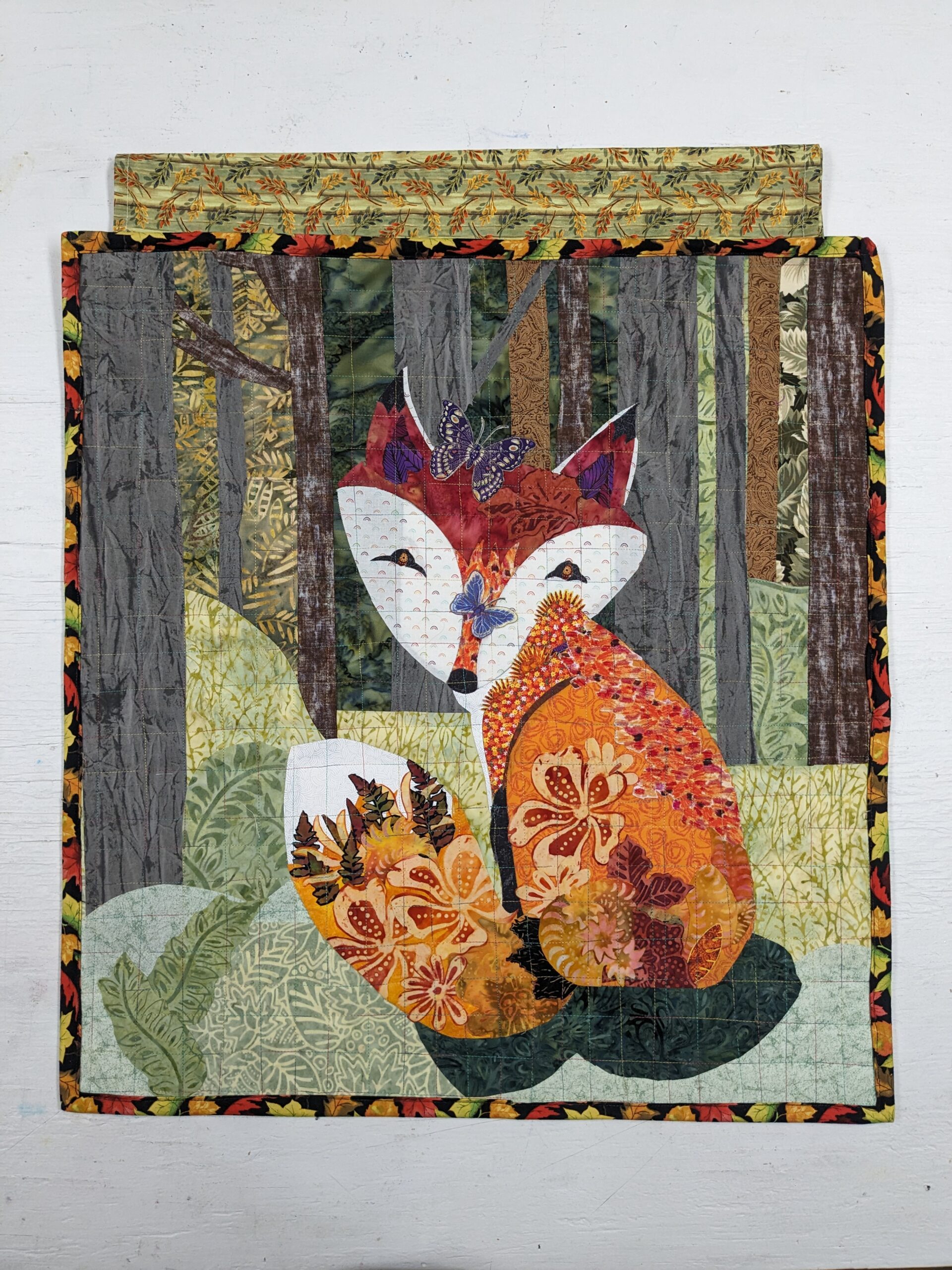 Textile Collage by Fiber Artist McFetters Caldwell. Collage of fabric depicting a fox.